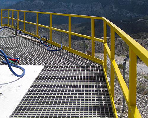 Safety Yellow FRP Guardrail and Light Gray Square Mesh Fiberglass Grating at FAA Facility at Angel's Peak in Mount Charleston Nevada