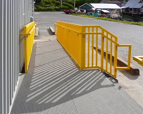 Light Gray Mini Mesh Grating Walkway and Safety Yellow Guardrail at United States Post Office in Kake Alaska